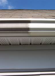 Remove gutter grime and stains with hand polishing service Partially polished gutters